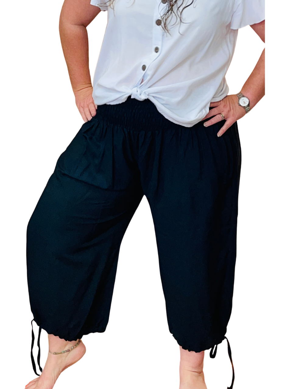 model wearing 3/4 Capri rayon pants