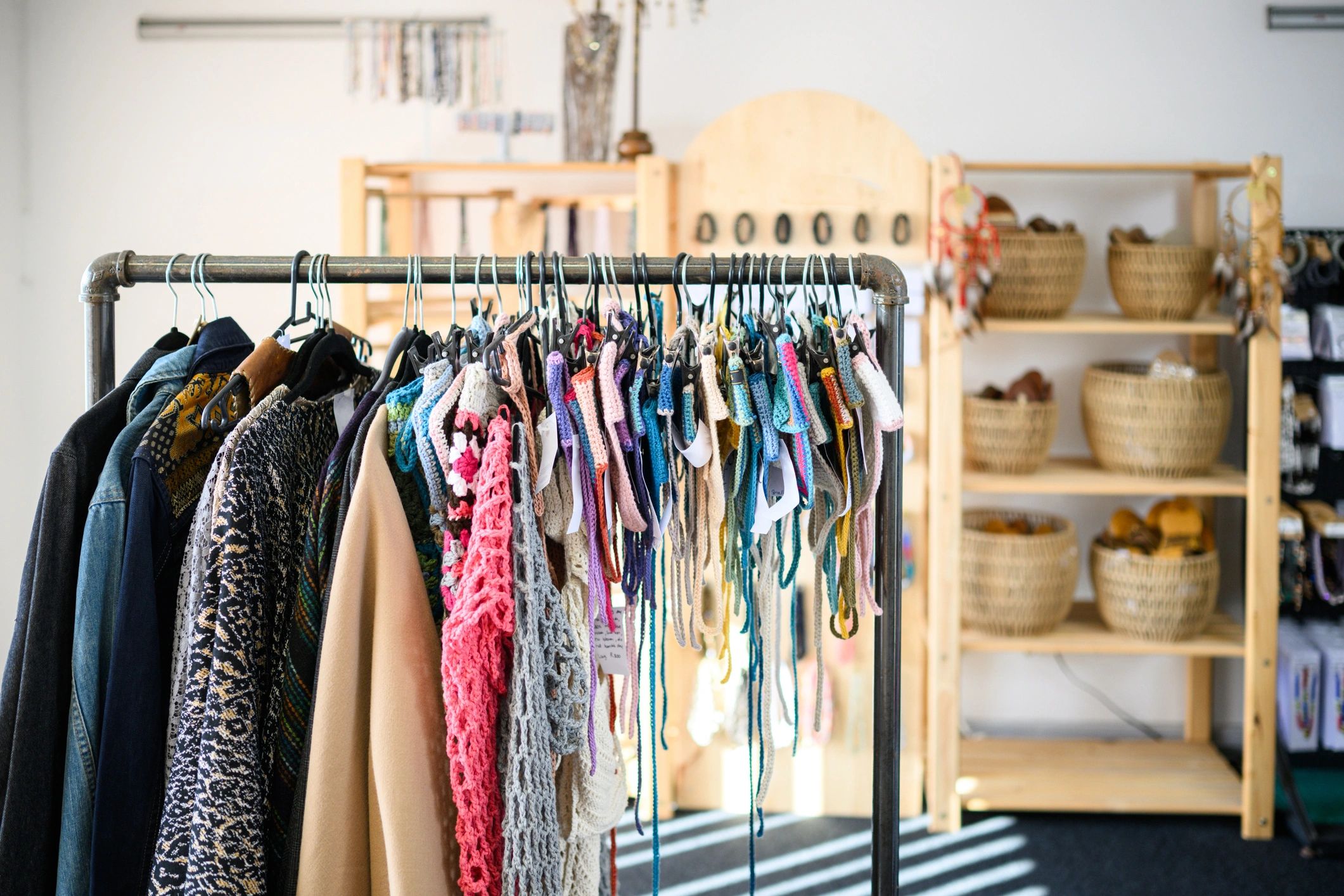 Colourful boho clothing displayed on a boutique rack